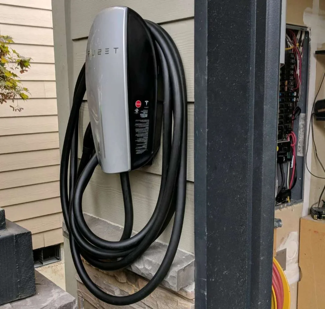 A licensed electrician performs a safe EV charger installation and panel upgrade.