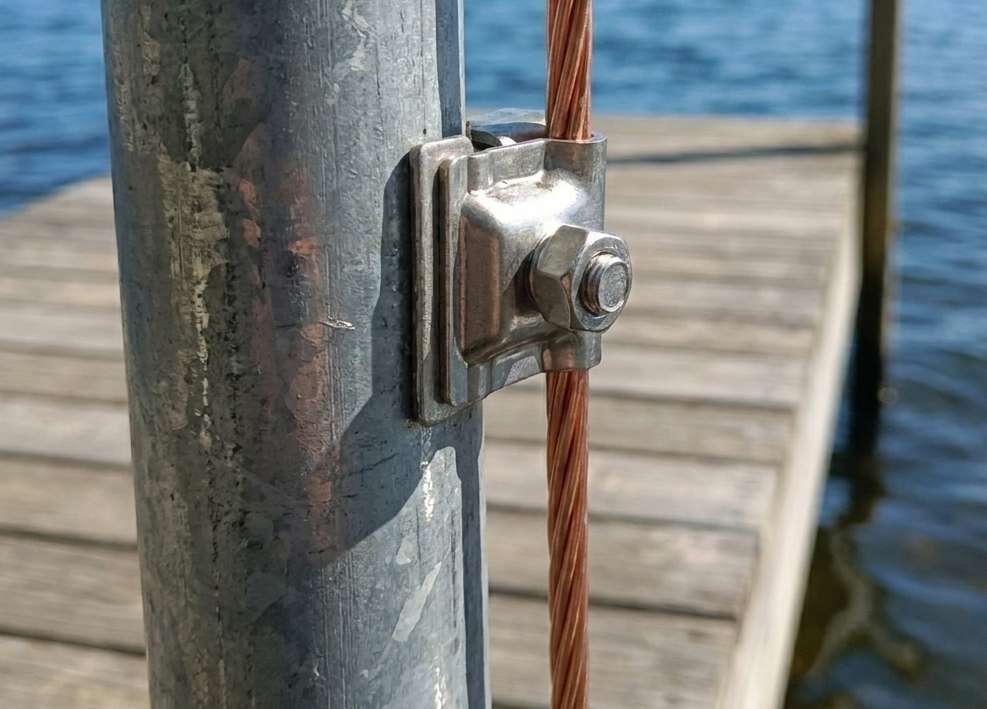 Equipotential bonding inspection on a metal dock and boat lift at a Minnesota lake property