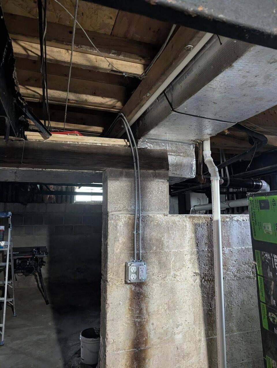 Dedicated 20A quad receptacle box mounted on basement pillar with MC cable