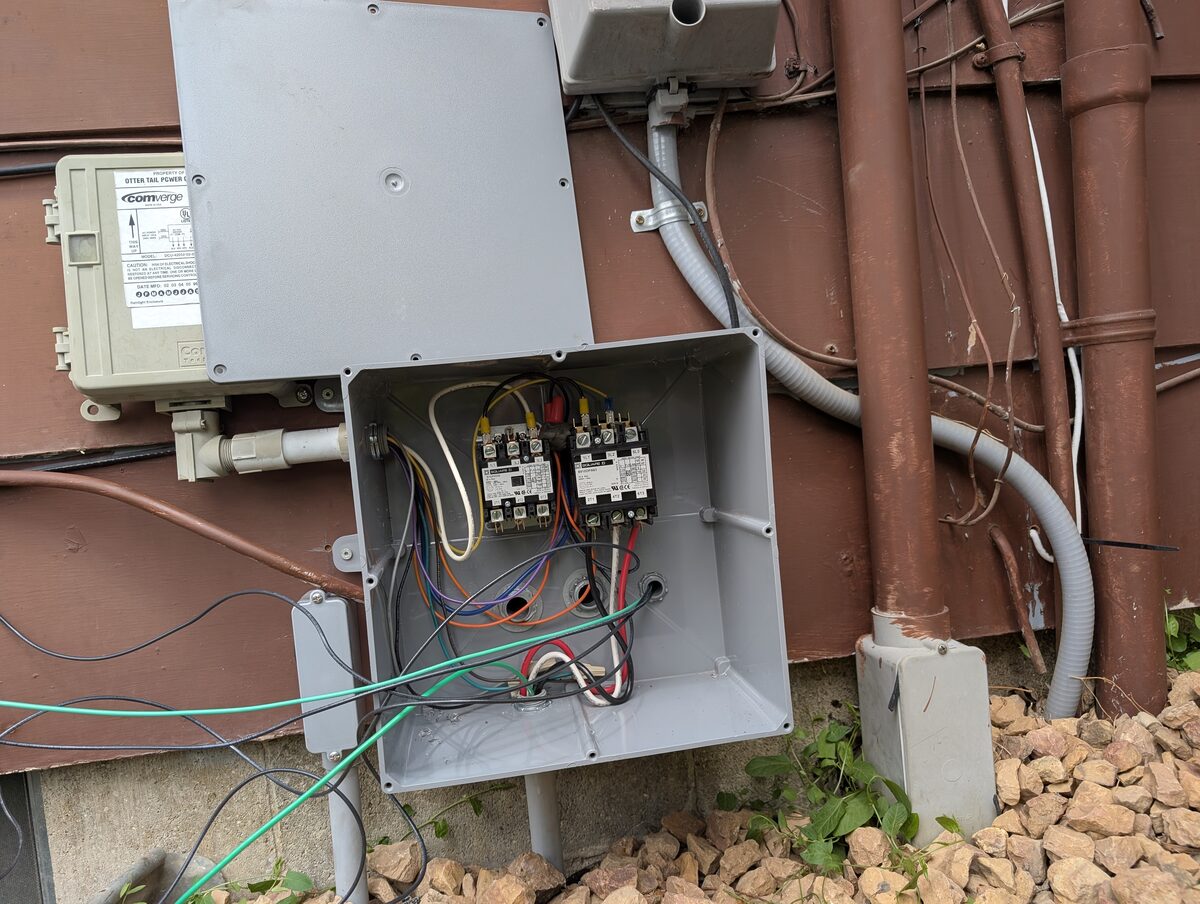 Dual contactor NEMA 3R enclosure with 60A EV charger and 40A water heater contactors for off-peak load control