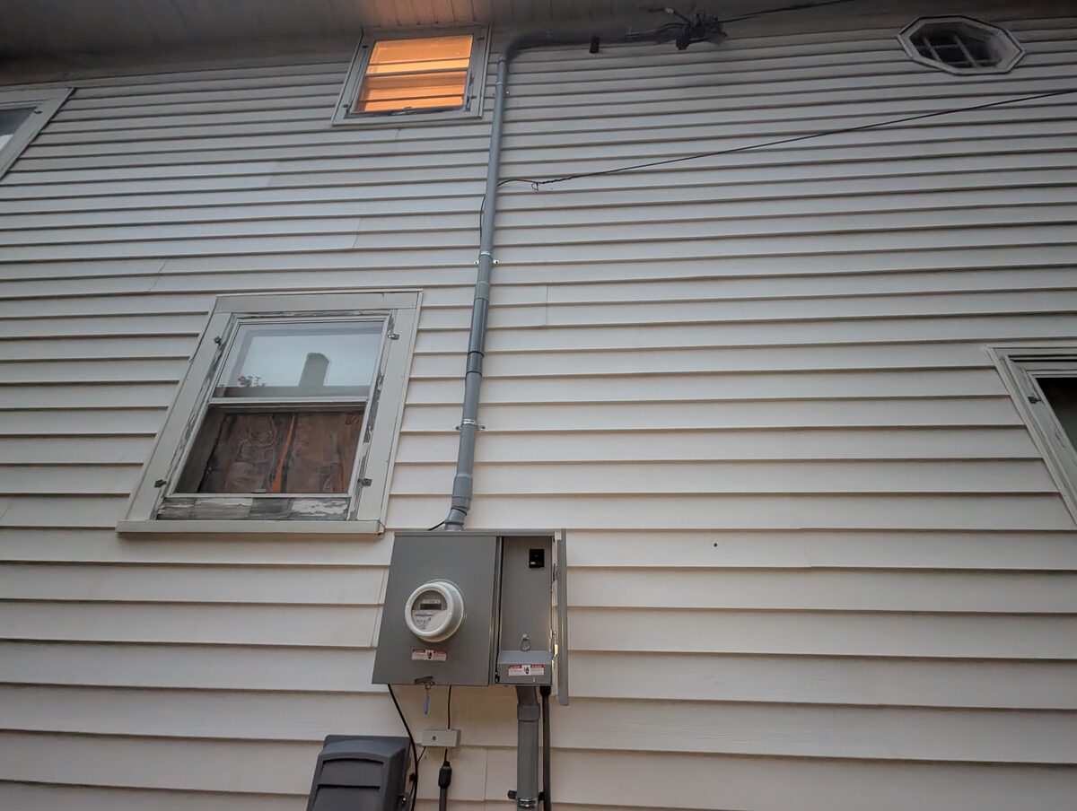 After: Relocated rigid service mast